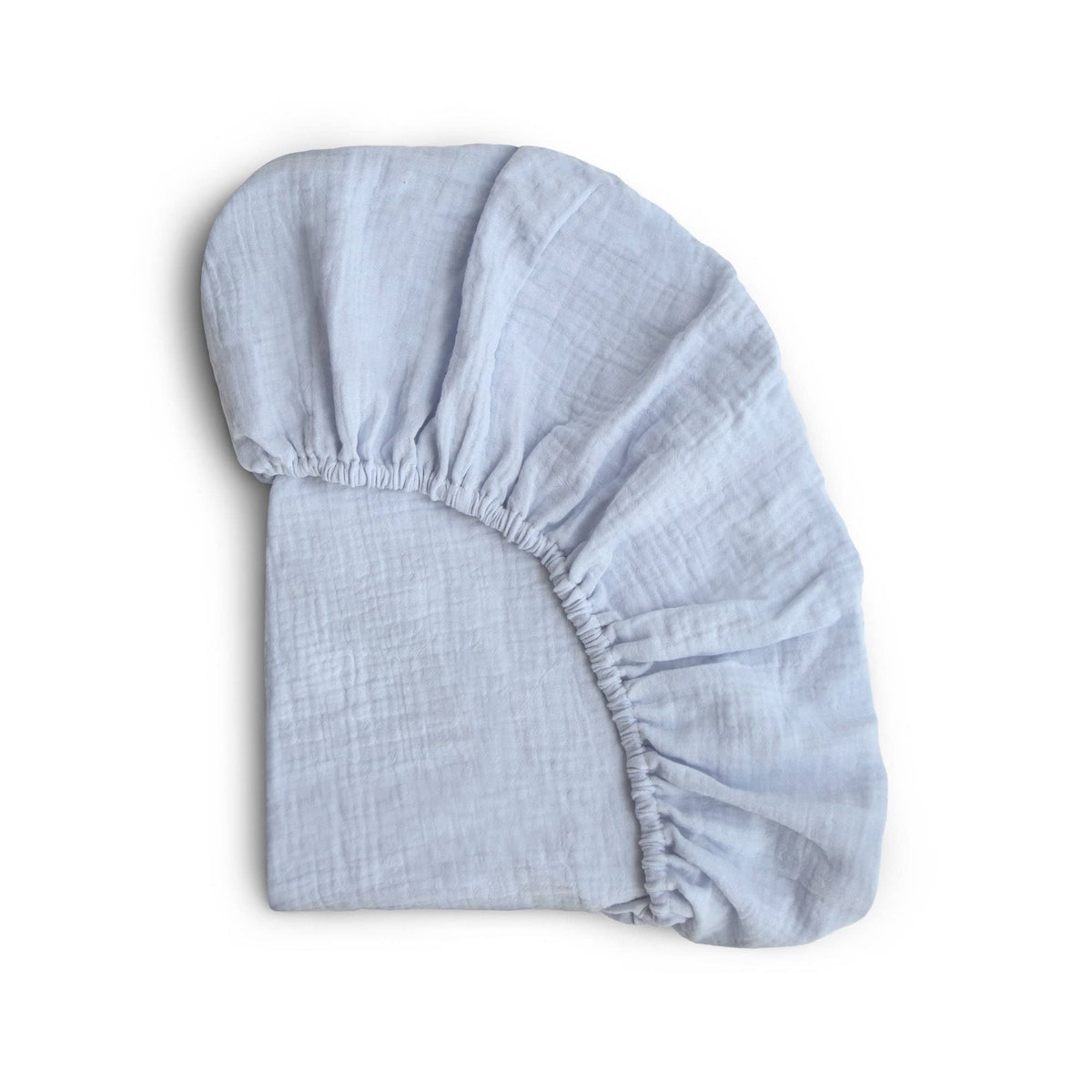 Mushie extra-soft muslin Mini crib sheet baby blue top view for cozy nights