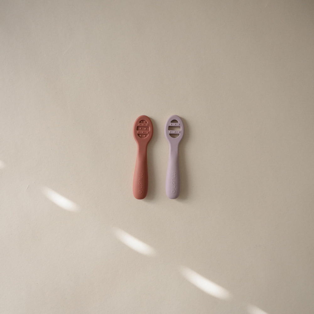 Mushie first-feeding spoons stage 2 open slots for thicker textures.