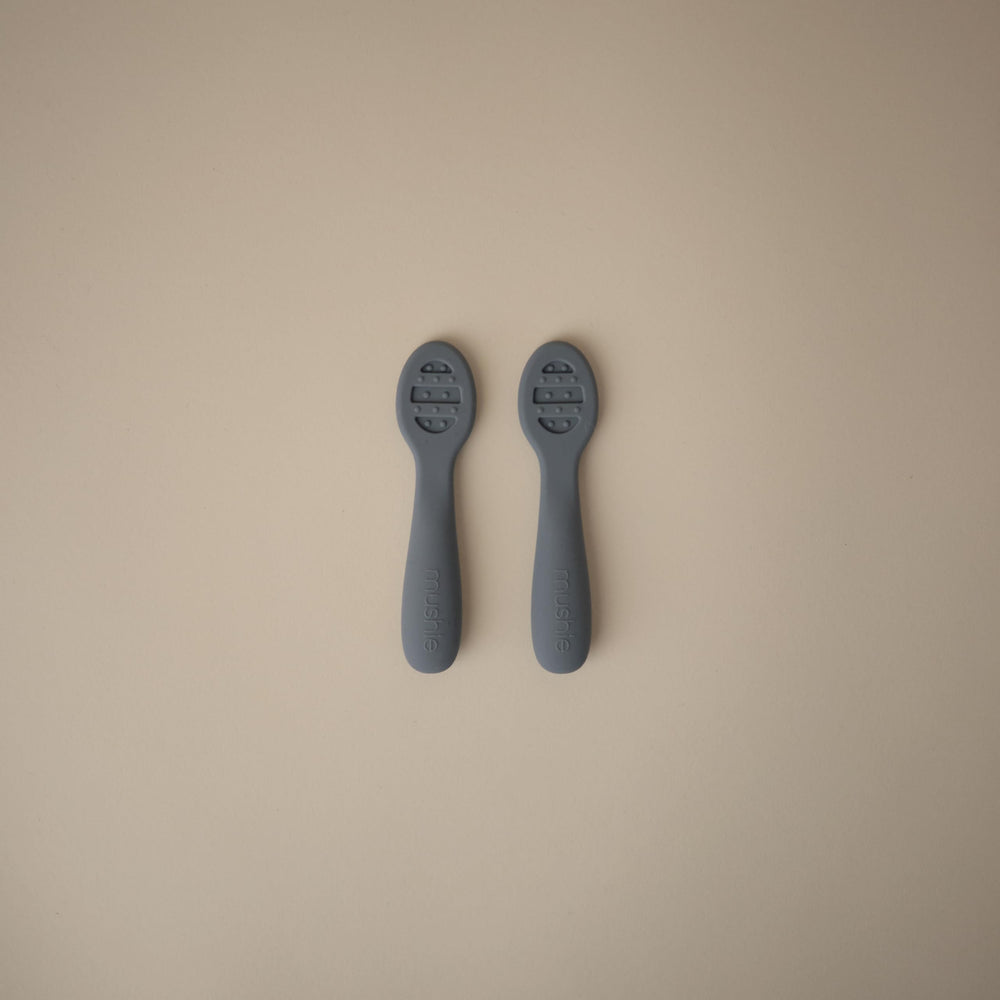 Mushie Stage 2 spoon showing open slots for thicker foods.
