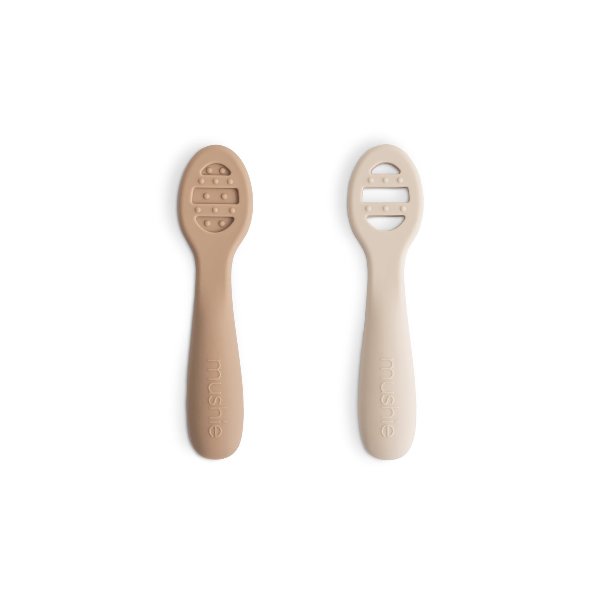 Mushie two-pack feeding spoons in natural shifting sand color, gentle for tender gums.