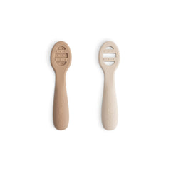 Mushie two-pack feeding spoons in natural shifting sand color, gentle for tender gums.