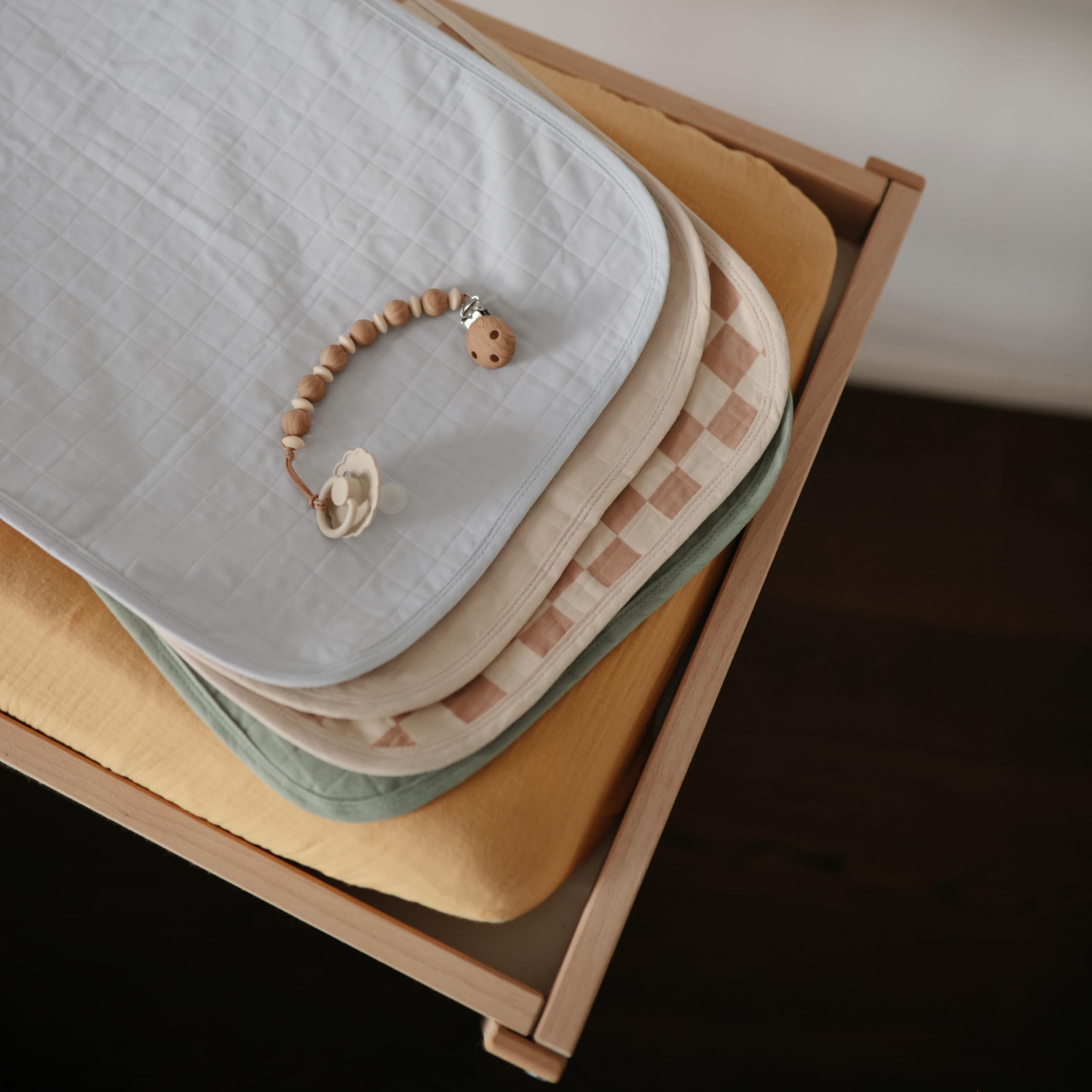 Fits most standard changing pads and easily stores in a diaper bag.