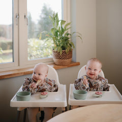 Mushie flat-design spoons are easy for tiny hands to grip.