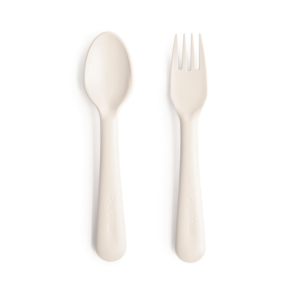 Mushie ivory flatware set for kids with easy-to-hold fork and spoon.