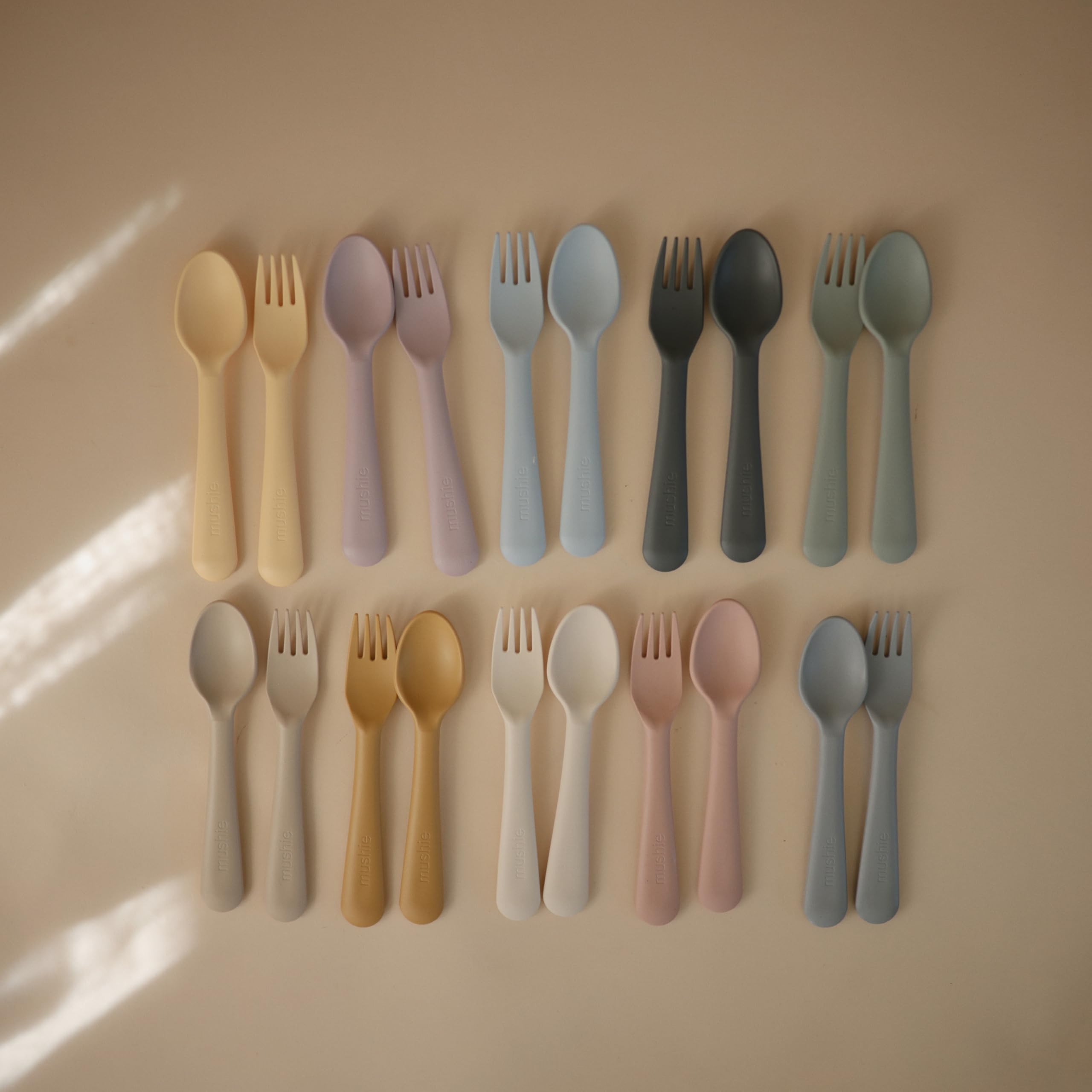 Mushie flatware pieces fit small hands, promoting independent eating routines