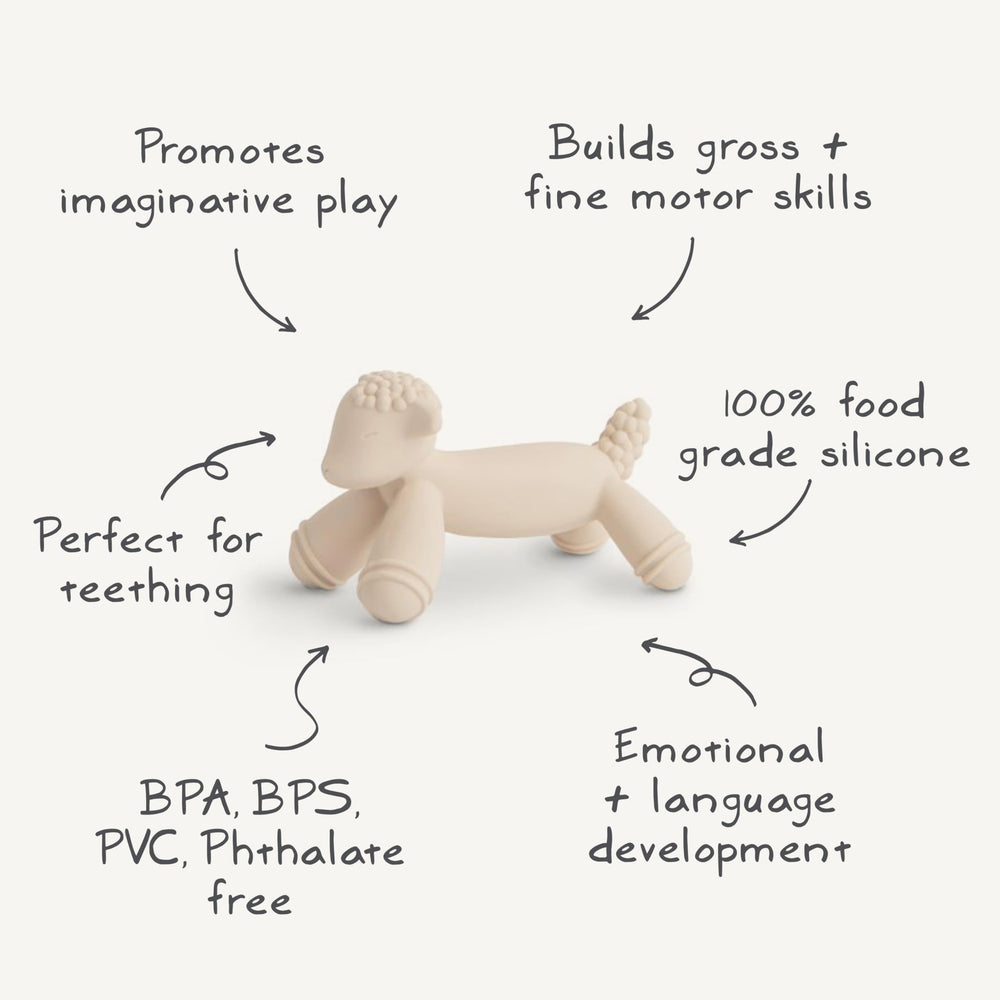 Mushie teether in hand shows child-friendly size