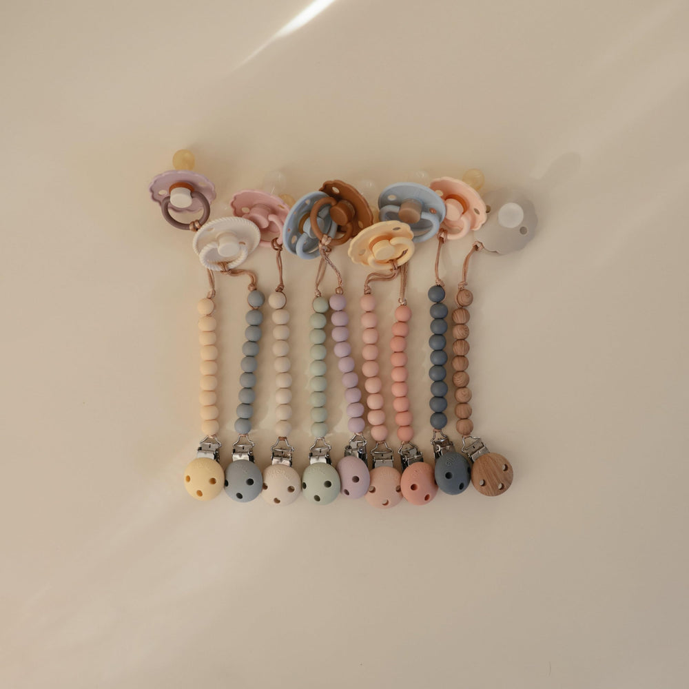 Mushie Hera pacifier clip is easy to clean with gentle hand washing.