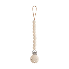 Mushie Hera pacifier clip with beaded stack keeps pacifier secure during outings.