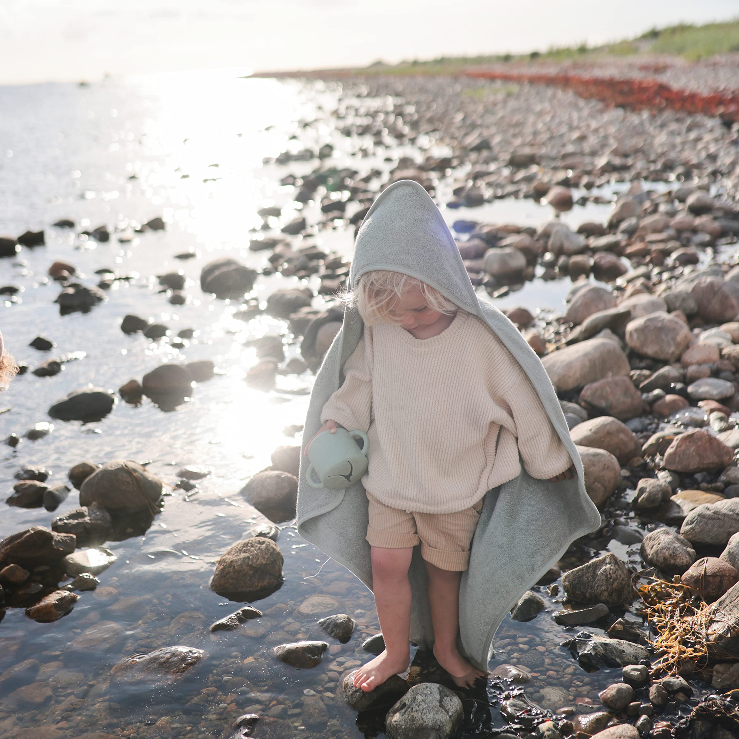 Mushie hooded towel Sea Mist soft texture closeup, natural fibers for sensitive skin.