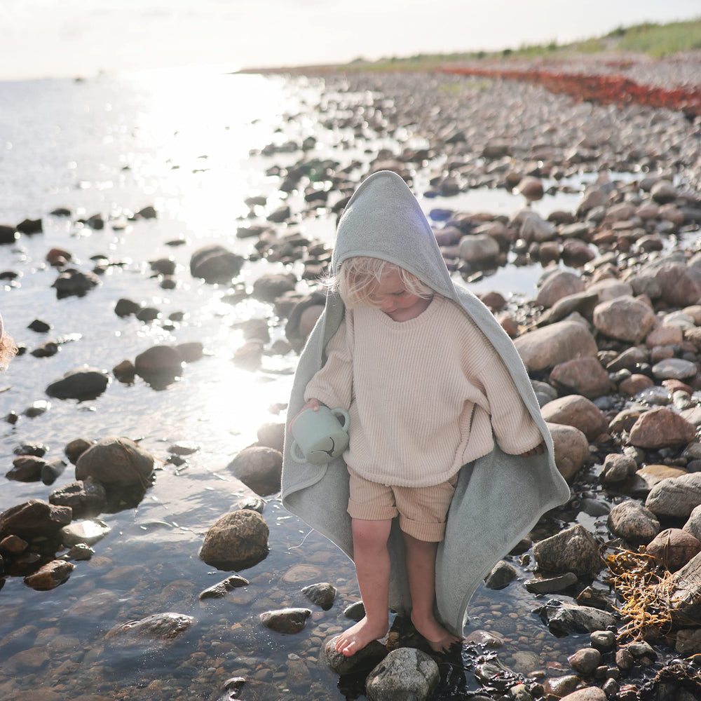 Mushie hooded towel Sea Mist soft texture closeup, natural fibers for sensitive skin.