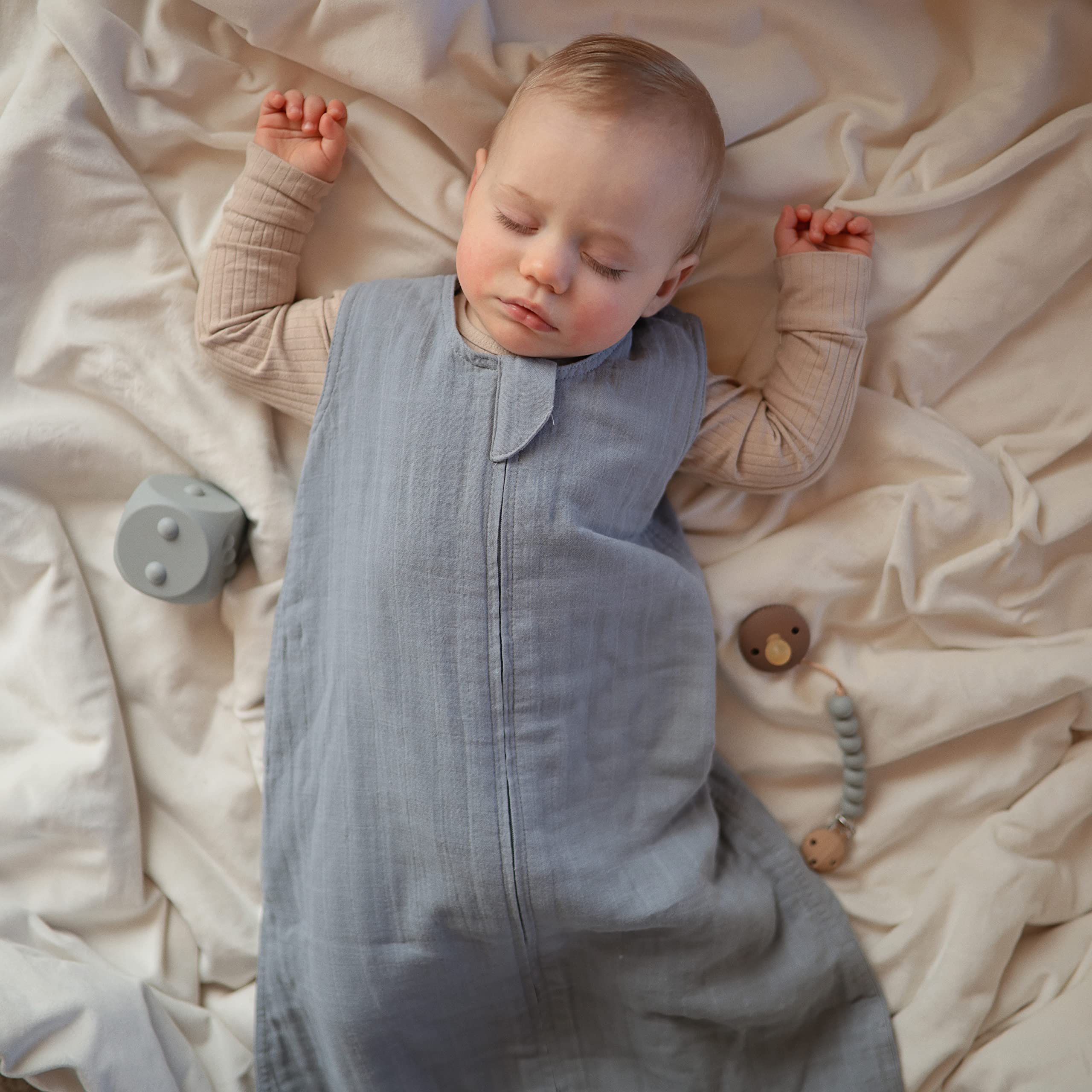 Mushie infant sleep sack offers full-body coverage while preventing crib tangles.