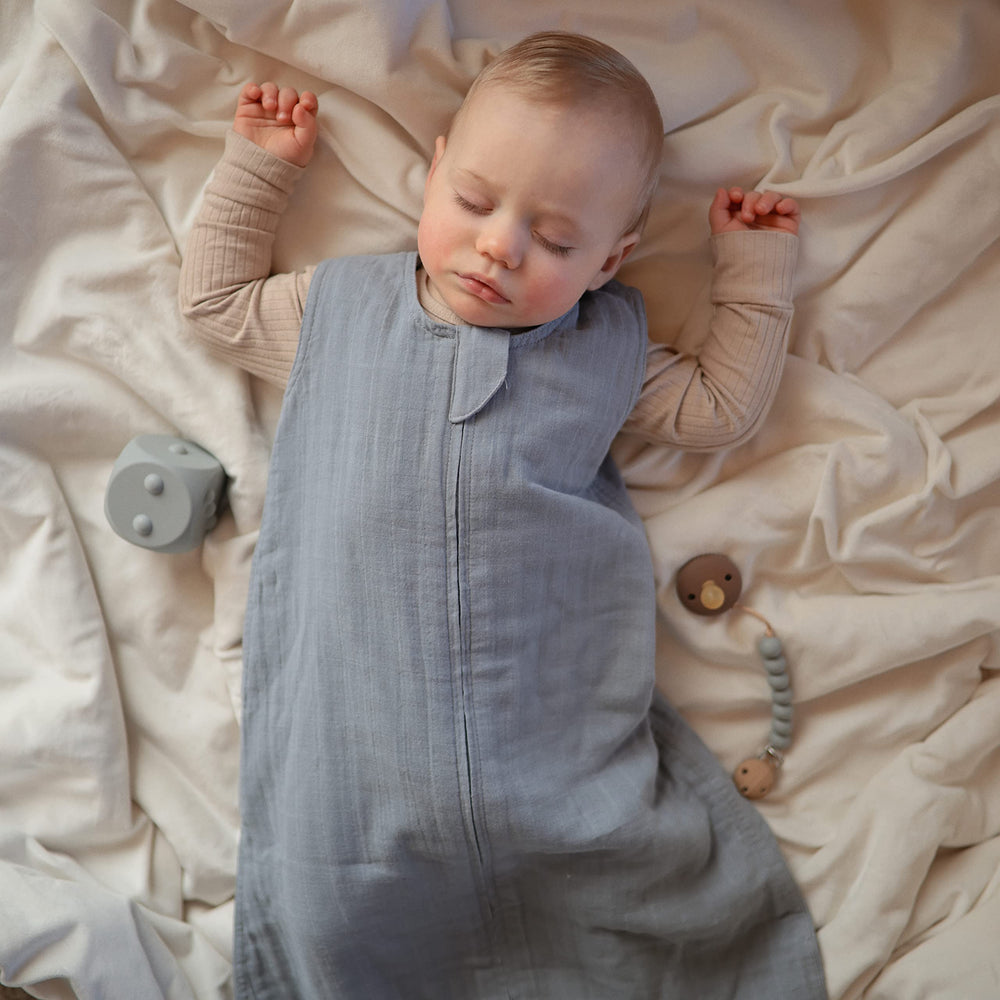 Mushie infant sleep sack offers full-body coverage while preventing crib tangles.