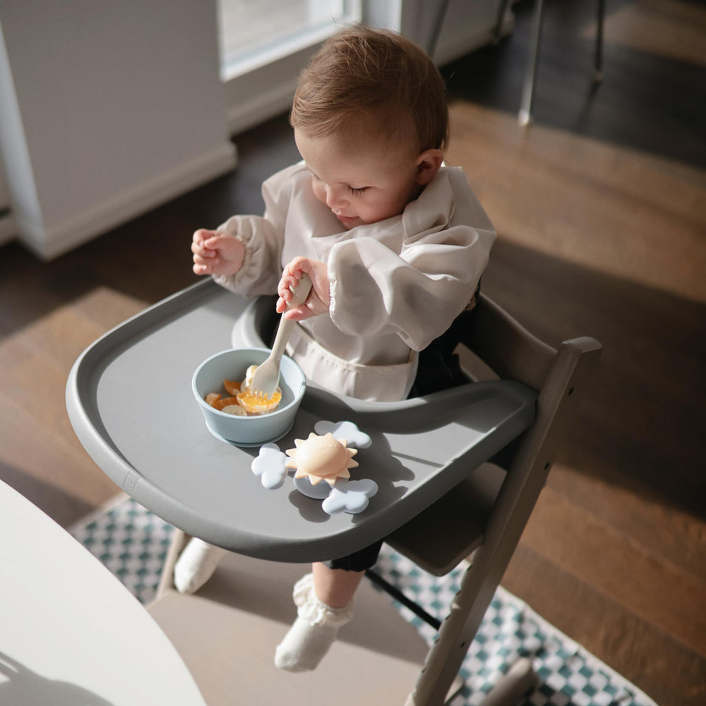 Mushie long sleeve bib water-resistant fabric keeps clothes dry