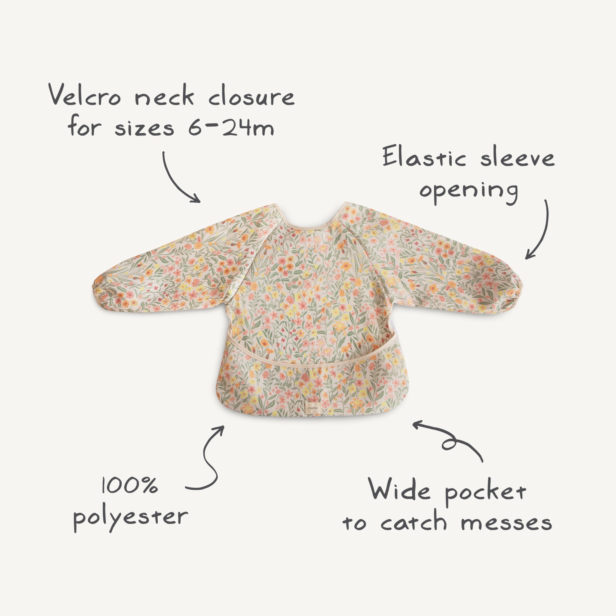 Mushie long sleeve bib worn on baby during mealtime