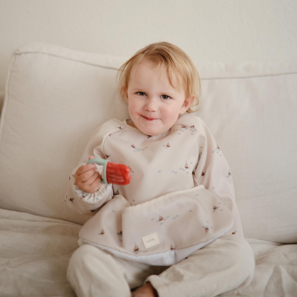 Mushie long sleeve bib sun cotton trim adds gentle comfort