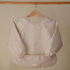 Mushie long sleeve bib sun wipe-clean material makes mealtime easy
