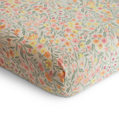 Mushie mini crib sheet on rectangle mattress showing snug fit for safe sleep.