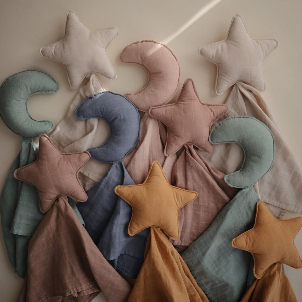 Mushie Moon Security Blanket used during nap time offers soothing familiarity and portability.