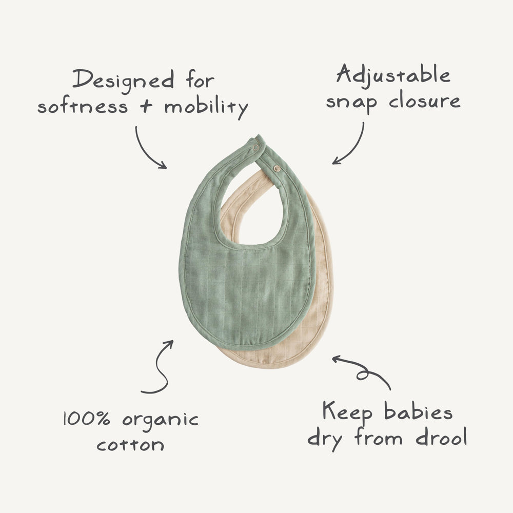 Mushie muslin bib snaps securely for a snug fit.