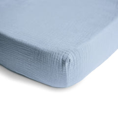 Mushie muslin fabric close-up shows breathable texture for baby comfort