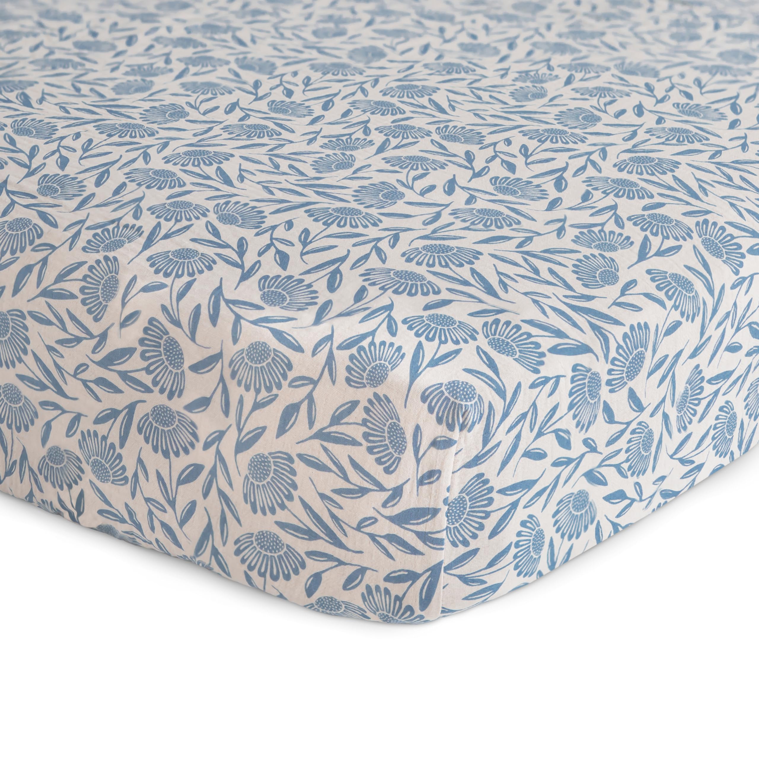 Mushie muslin crib sheet with elastic edges for a snug, easy-fit.