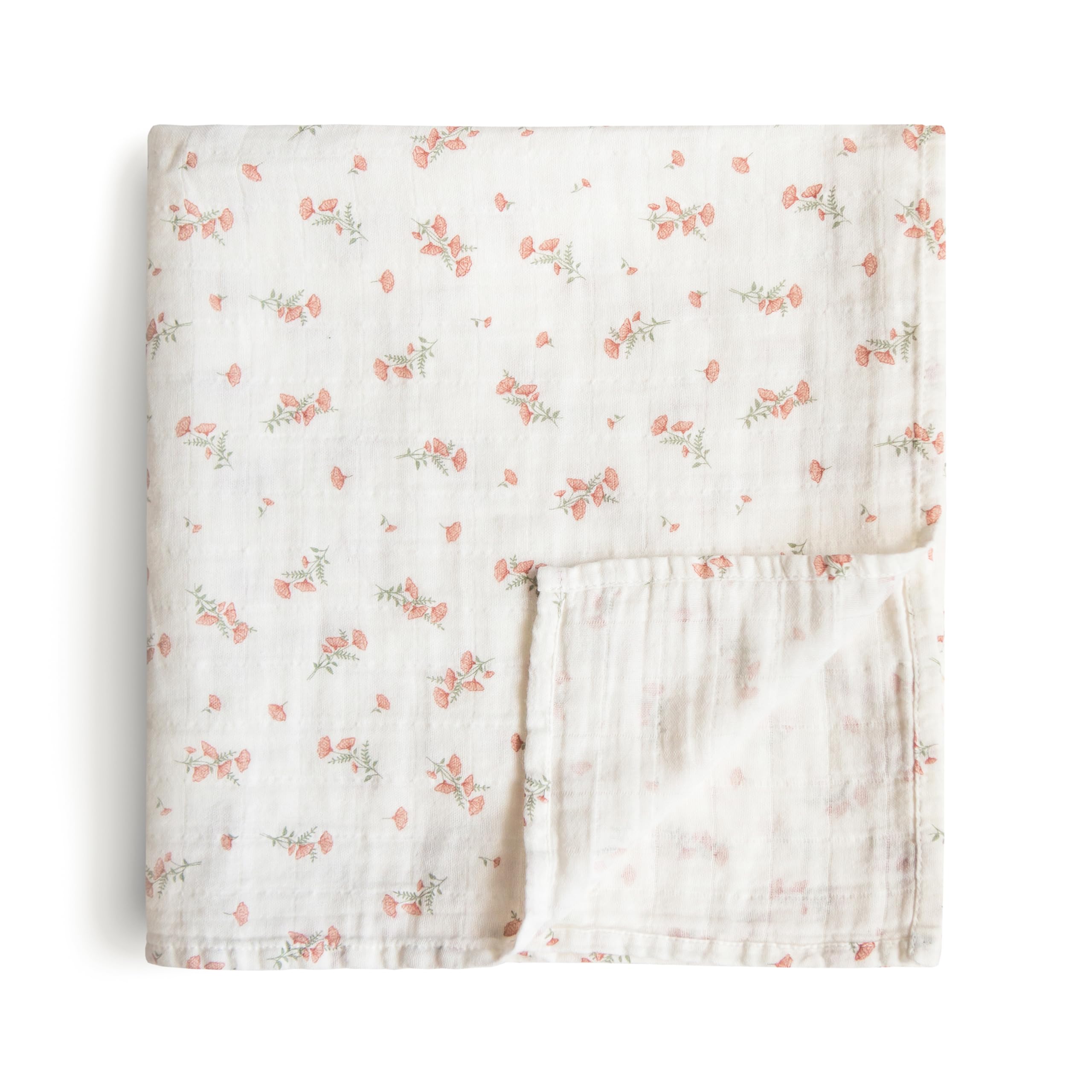Mushie muslin swaddle blanket in pink flowers offers breathable warmth and cozy coverage