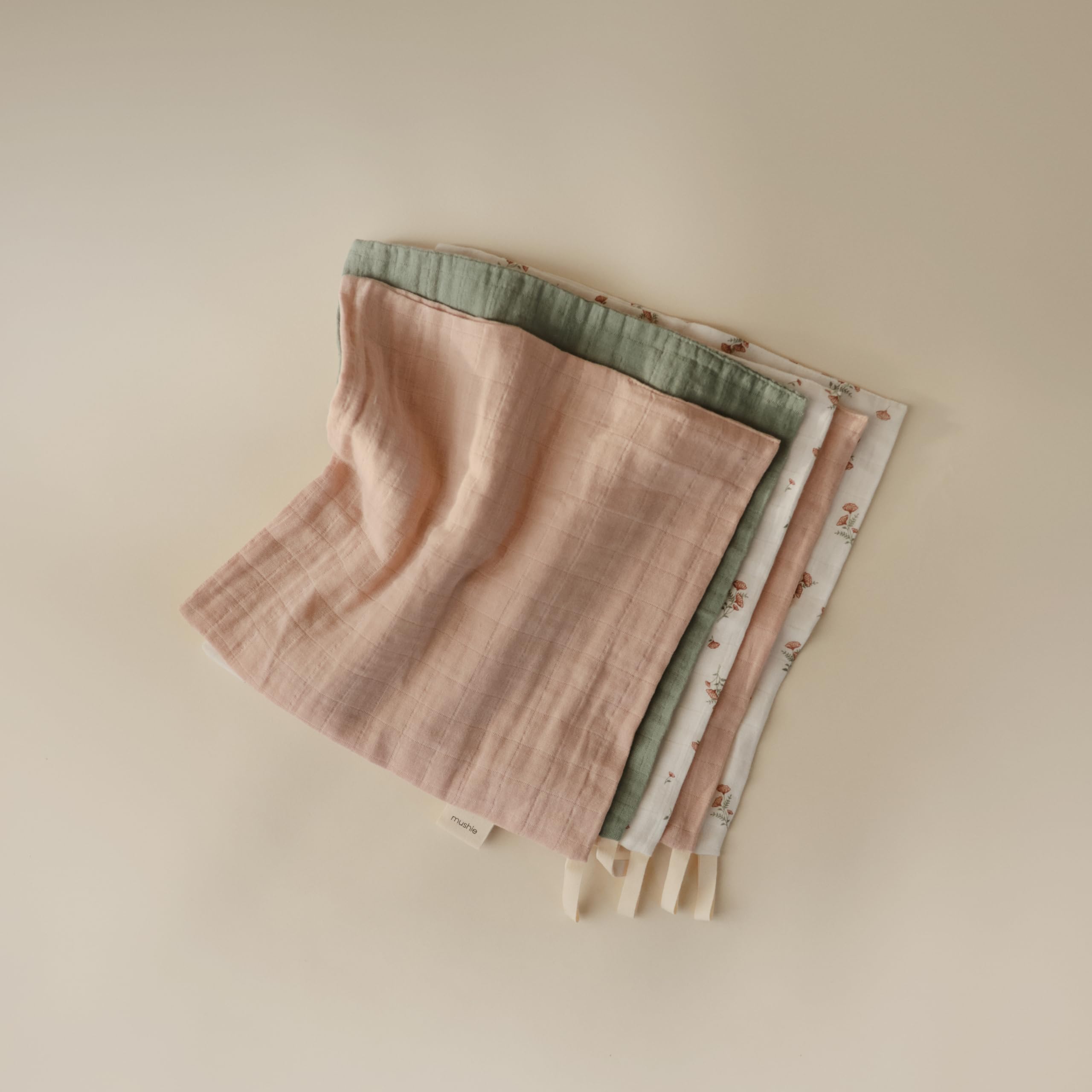 Mushie pink flowers washcloths offer soft skin care.