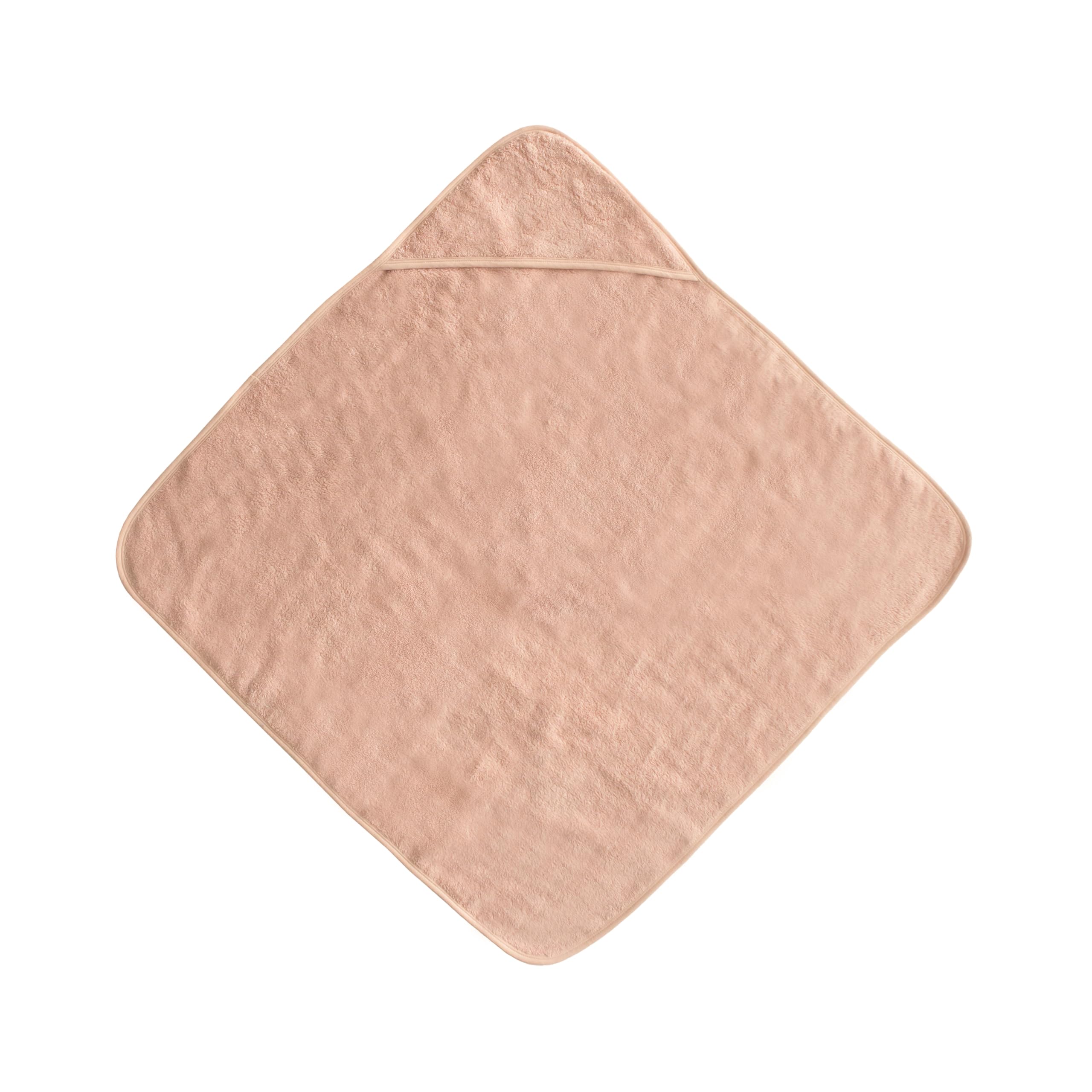 Closeup of Mushie organic cotton baby towel highlighting breathable, premium material.