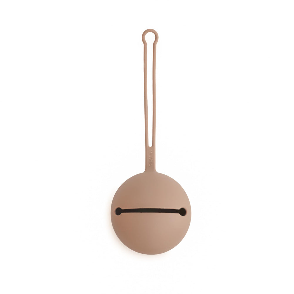 Mushie pacifier silicone case closeup, soft material and clean design for easy on-the-go use.