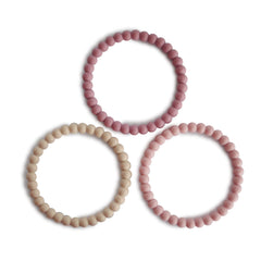 Mushie Pearl Teether Bracelet in Linen color, gentle silicone for soothing gums.