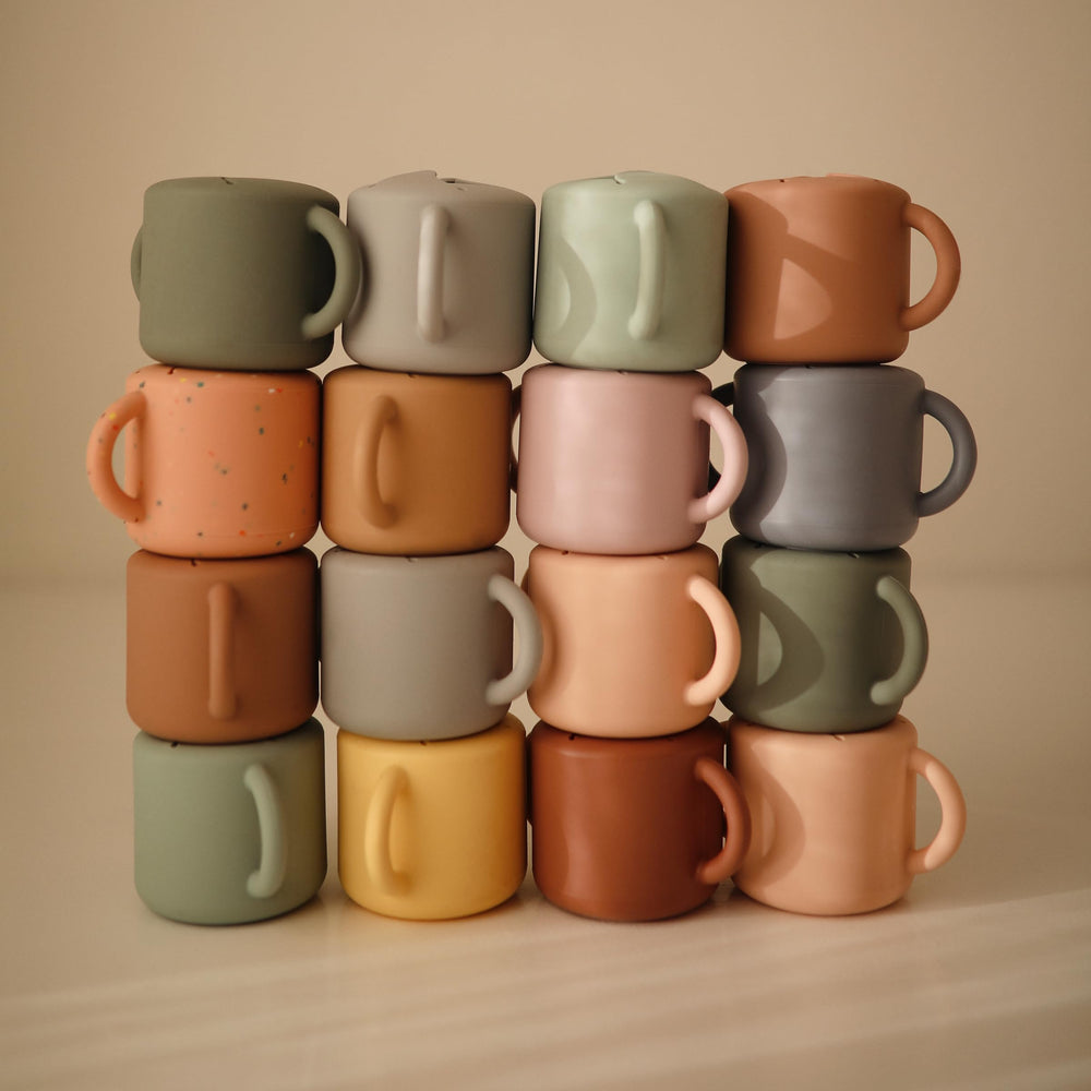 Mushie powder pink confetti color snack cup for playful meals.