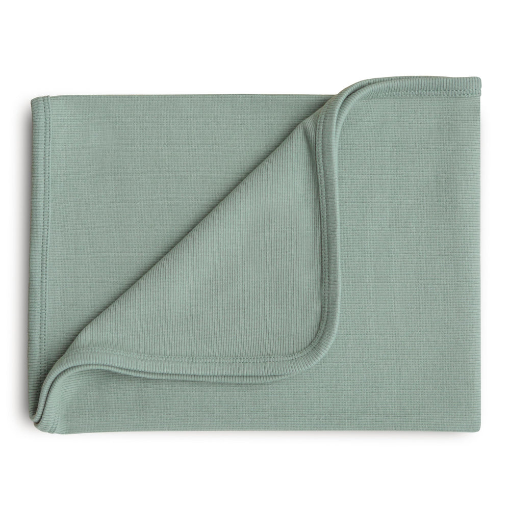 Mushie ribbed baby blanket closeup in roman green showing soft organic cotton texture