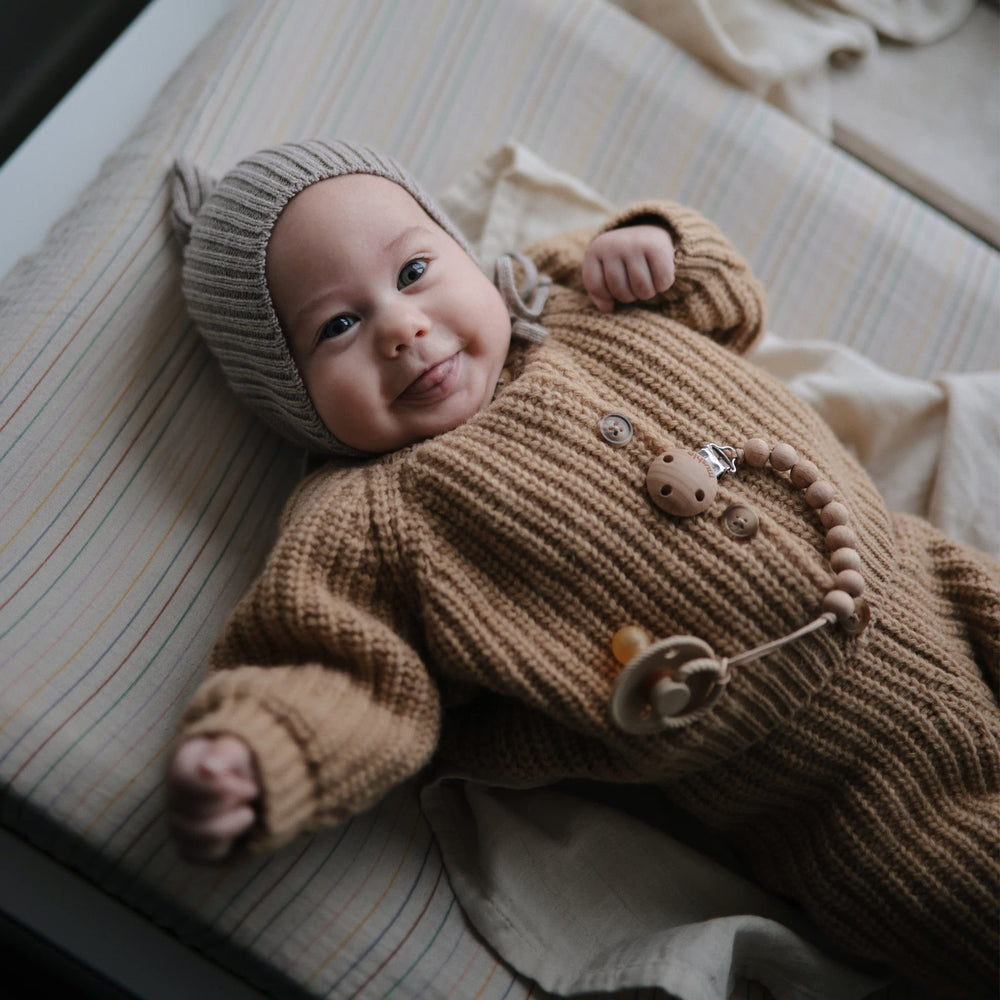 Mushie Roman Green muslin fabric shows breathable texture for baby comfort.