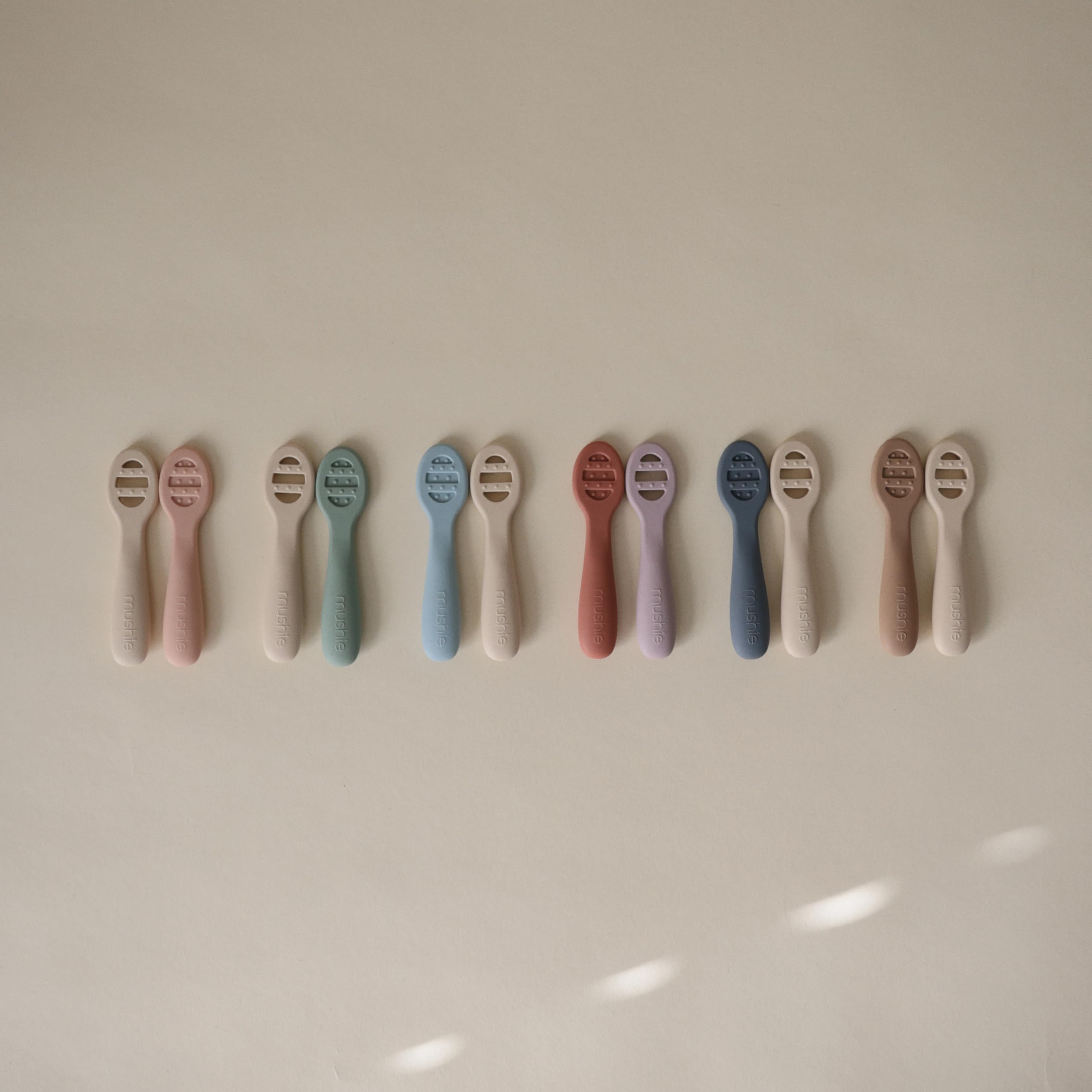 Mushie rose and soft lilac colorway fits chic nurseries.