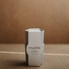 Mushie Sage cups stacked in a two-pack for compact storage.