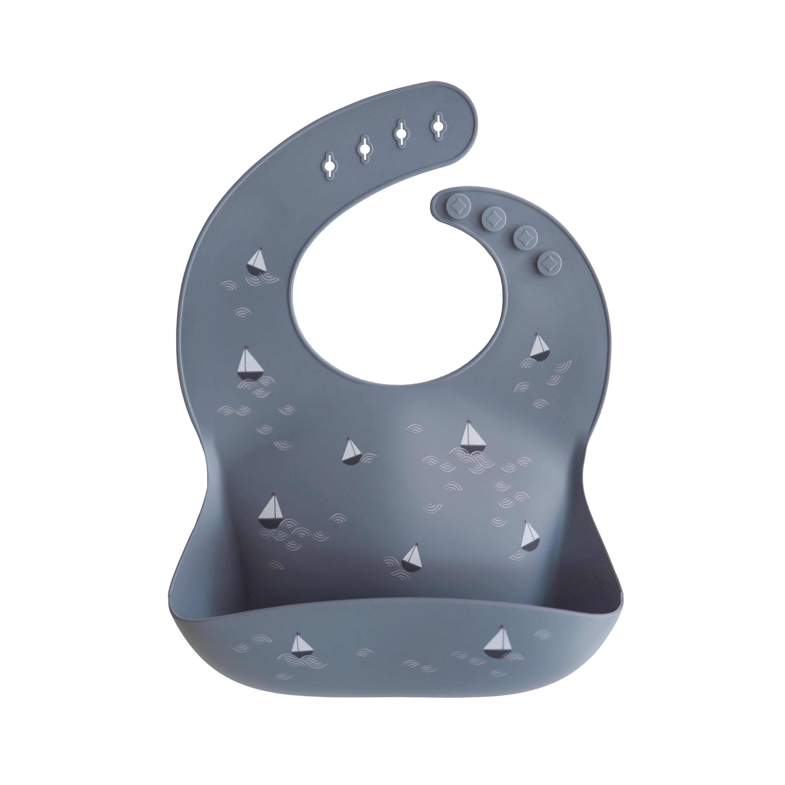 Mushie silicone baby bib adjustable fit with boats pattern, keeps mess in the pocket.