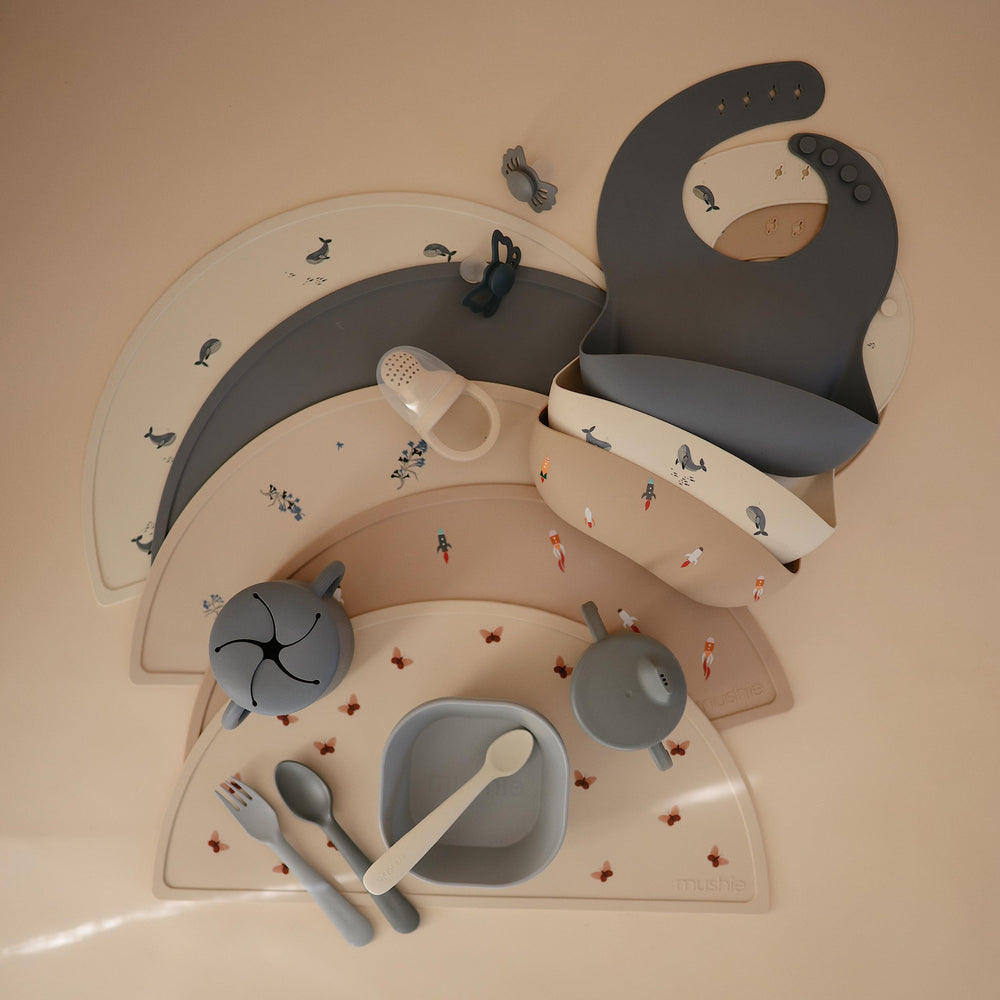 Mushie bib BPA-free closeup indicating baby-safe material