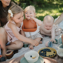 Food-grade silicone Mushie bib safe for babies with rainbow colors