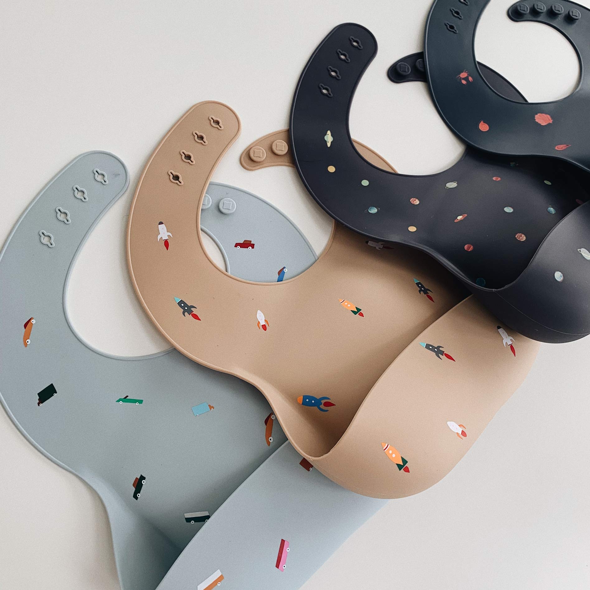 mushie silicone baby bib retro cars adjustable fit grows with your child while staying comfy.