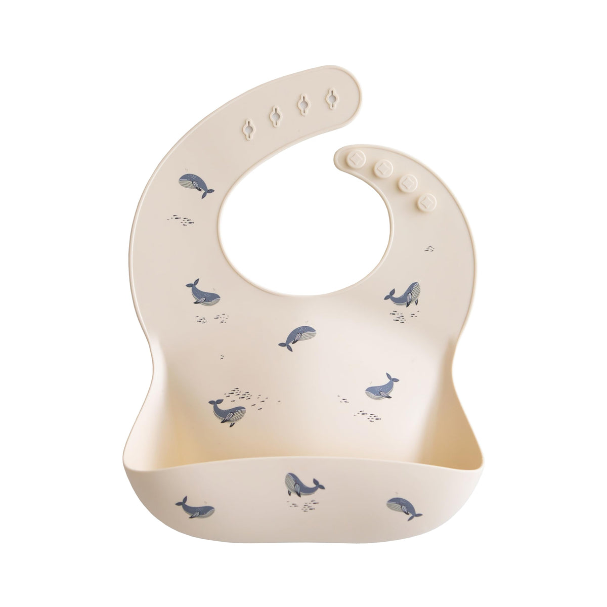 Mushie silicone baby bib in whales pattern keeps mealtimes stylish and tidy.