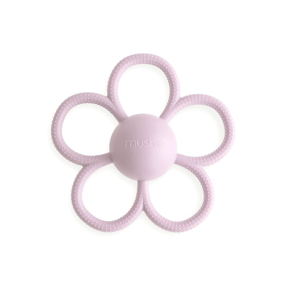 Mushie Daisy rattle teether in soft lilac designed for teething and play.
