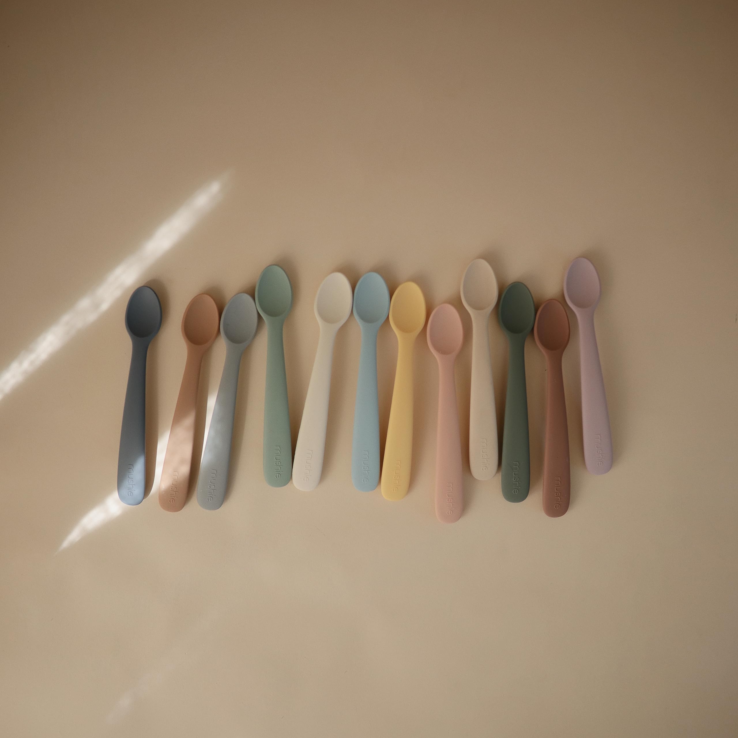 Mushie caregiver-friendly spoon design supports safe supervision.