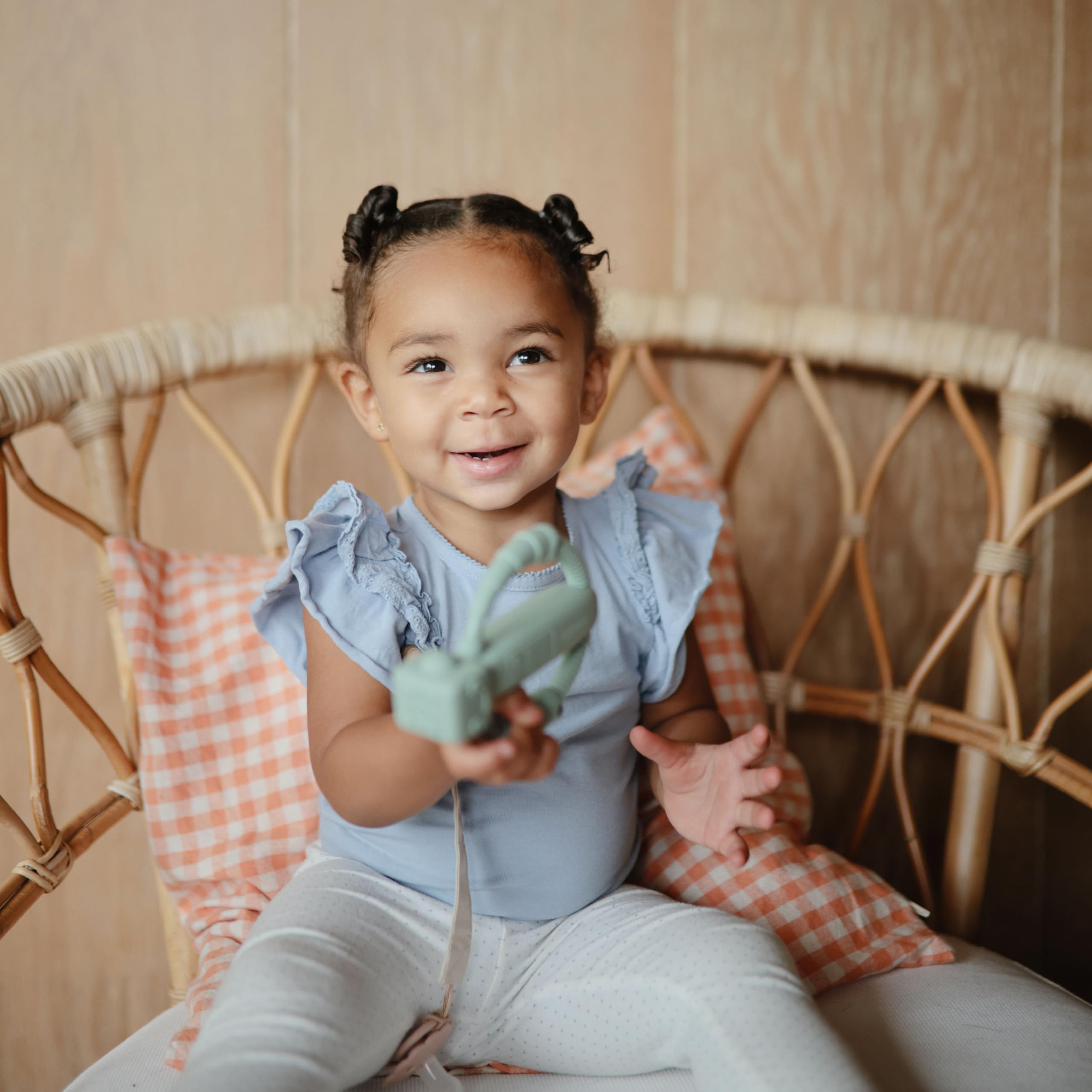 Mushie rattle teether designed for early teething milestones and play.