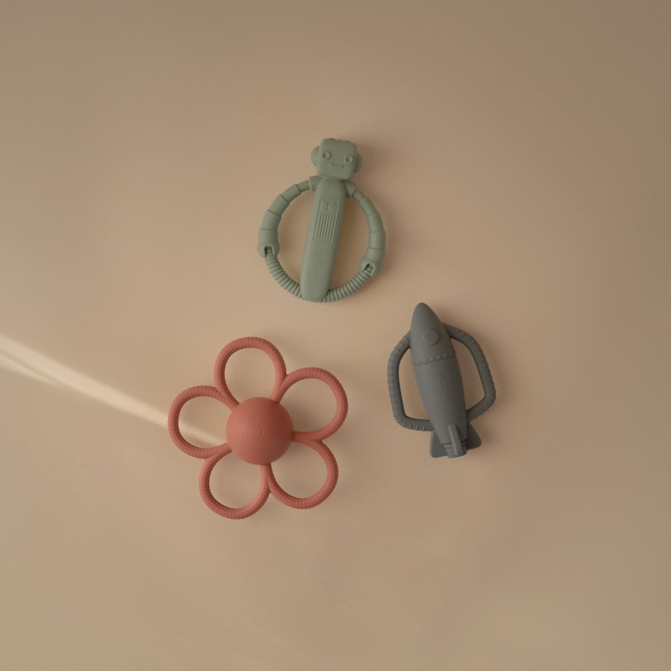Mushie textured silicone surface massages gums during soft teething play