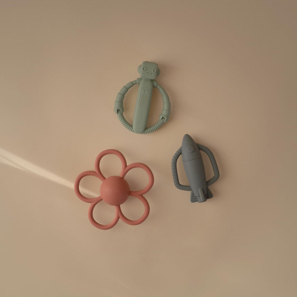 Mushie textured silicone surface massages gums during soft teething play