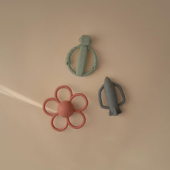 Mushie textured silicone surface massages gums during soft teething play