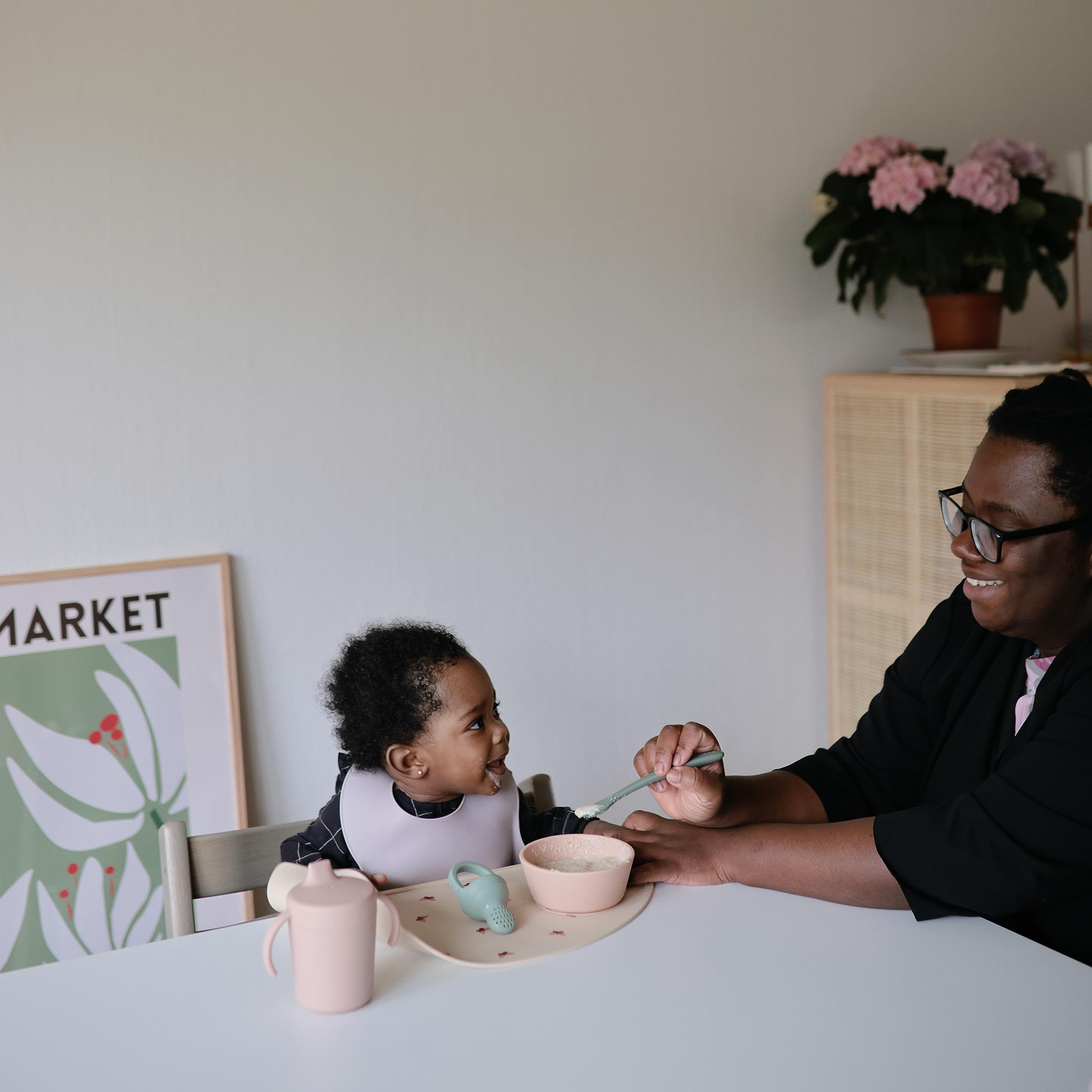 Mushie silicone spoons for mealtime, colorful design engages little eaters.