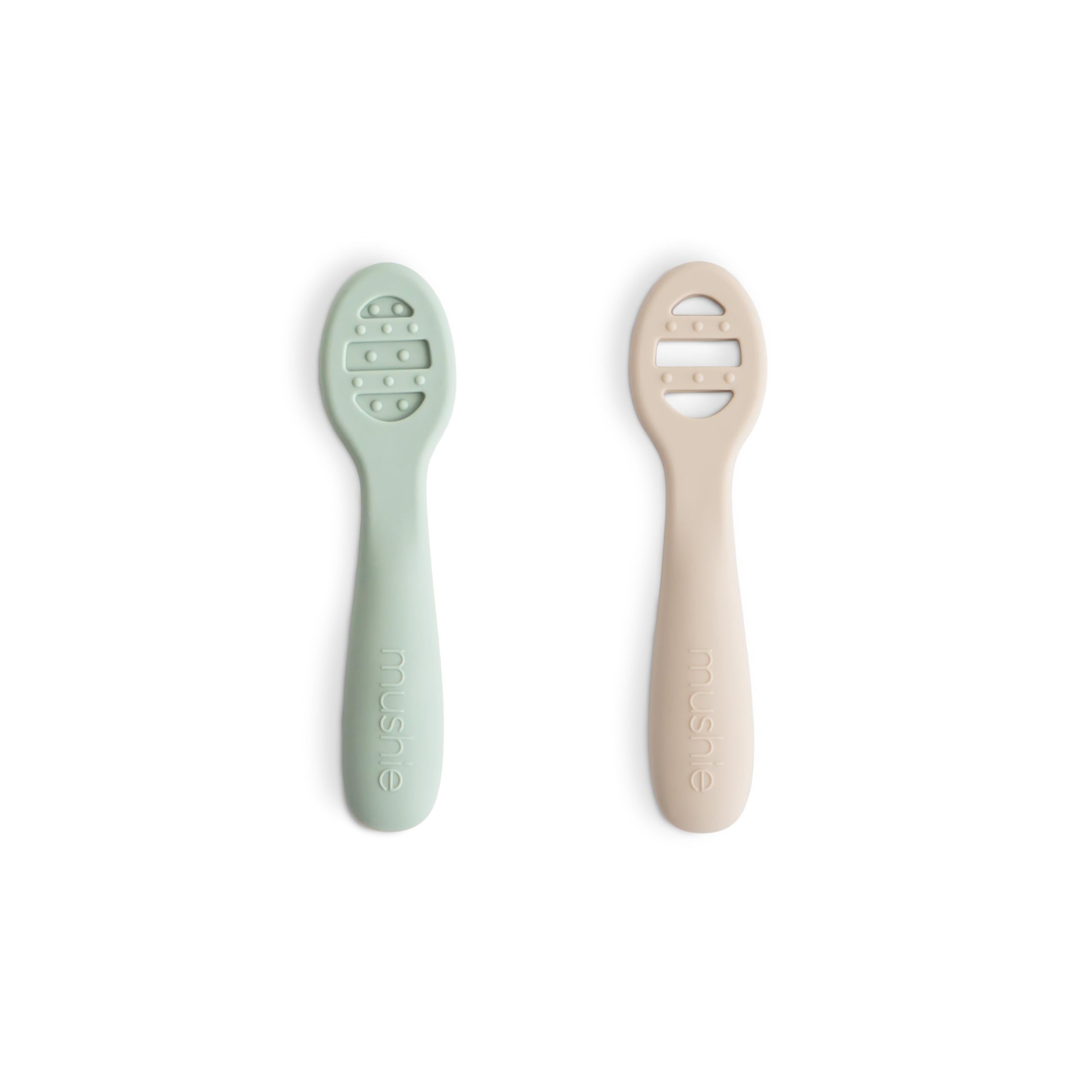 Mushie silicone first feeding spoons in Cambridge Blue for gentle self-feeding.