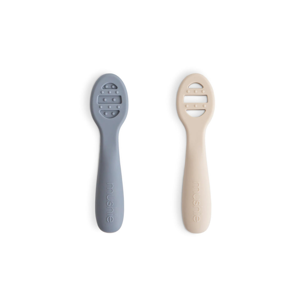 Mushie silicone first feeding spoons in packaging, ready for gentle self-feeding.