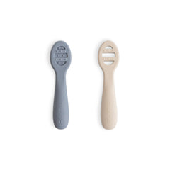 Mushie silicone first feeding spoons in packaging, ready for gentle self-feeding.